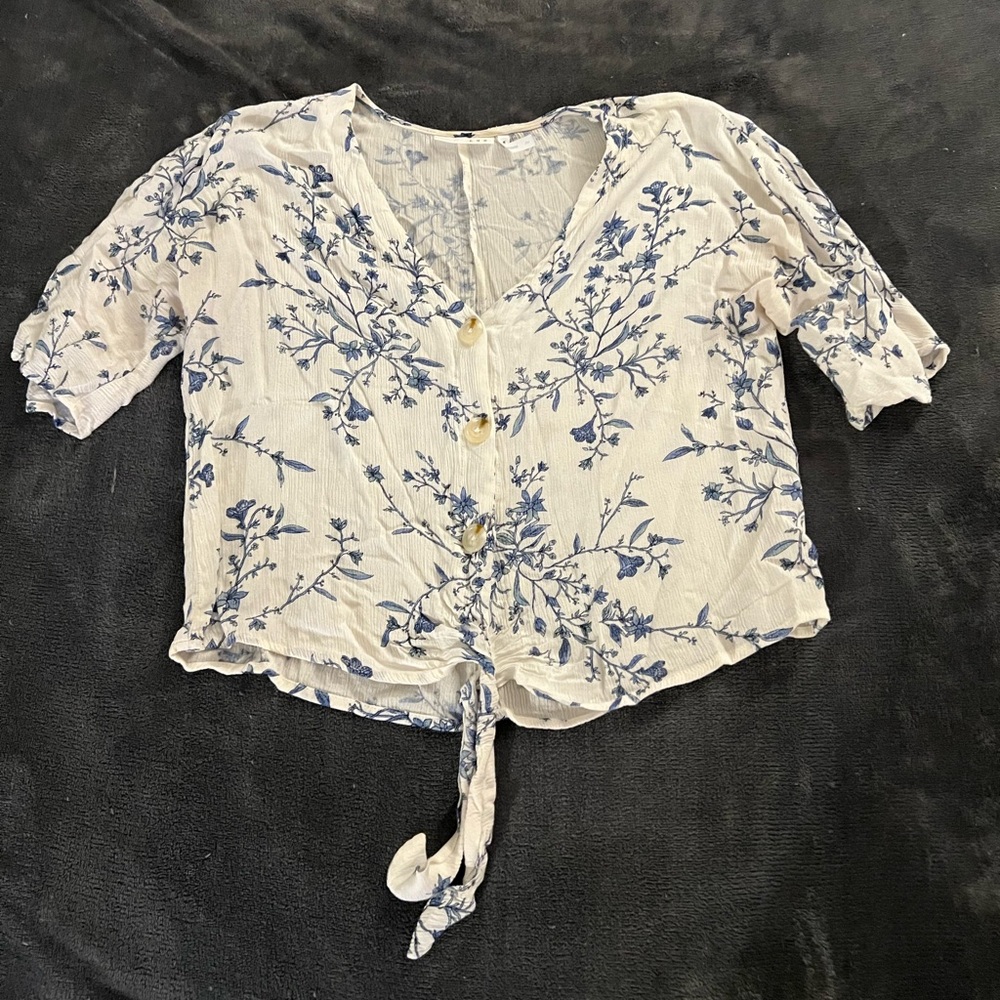 White and blue floral patterned blouse
